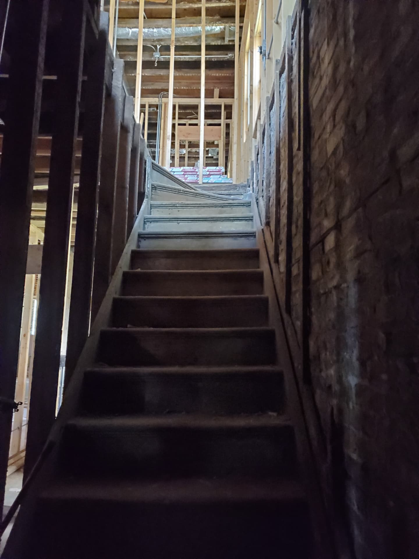 Original staircase leading to an upper level under renovation