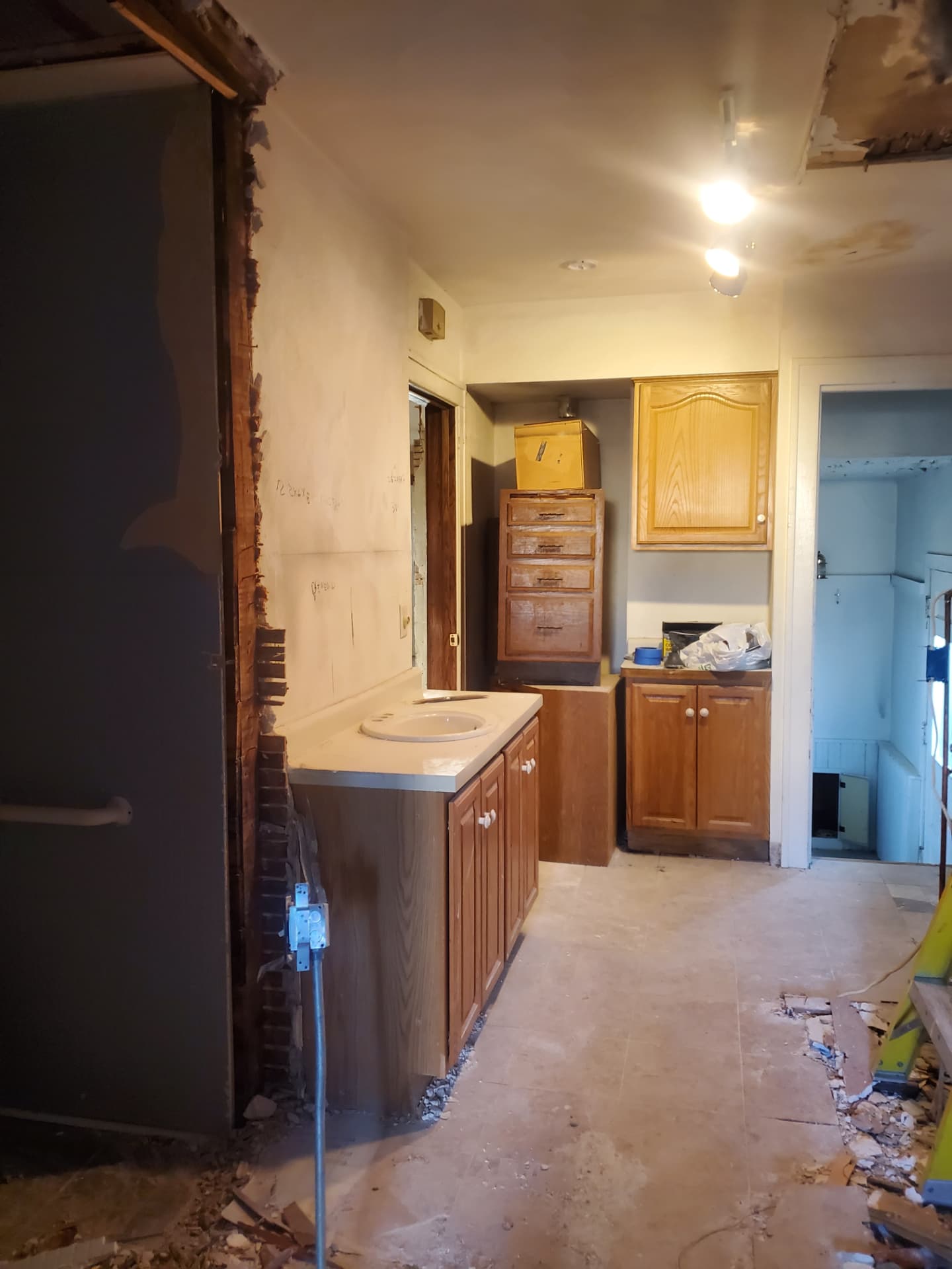 Hallway and vanity area with original cabinetry before renovation work began